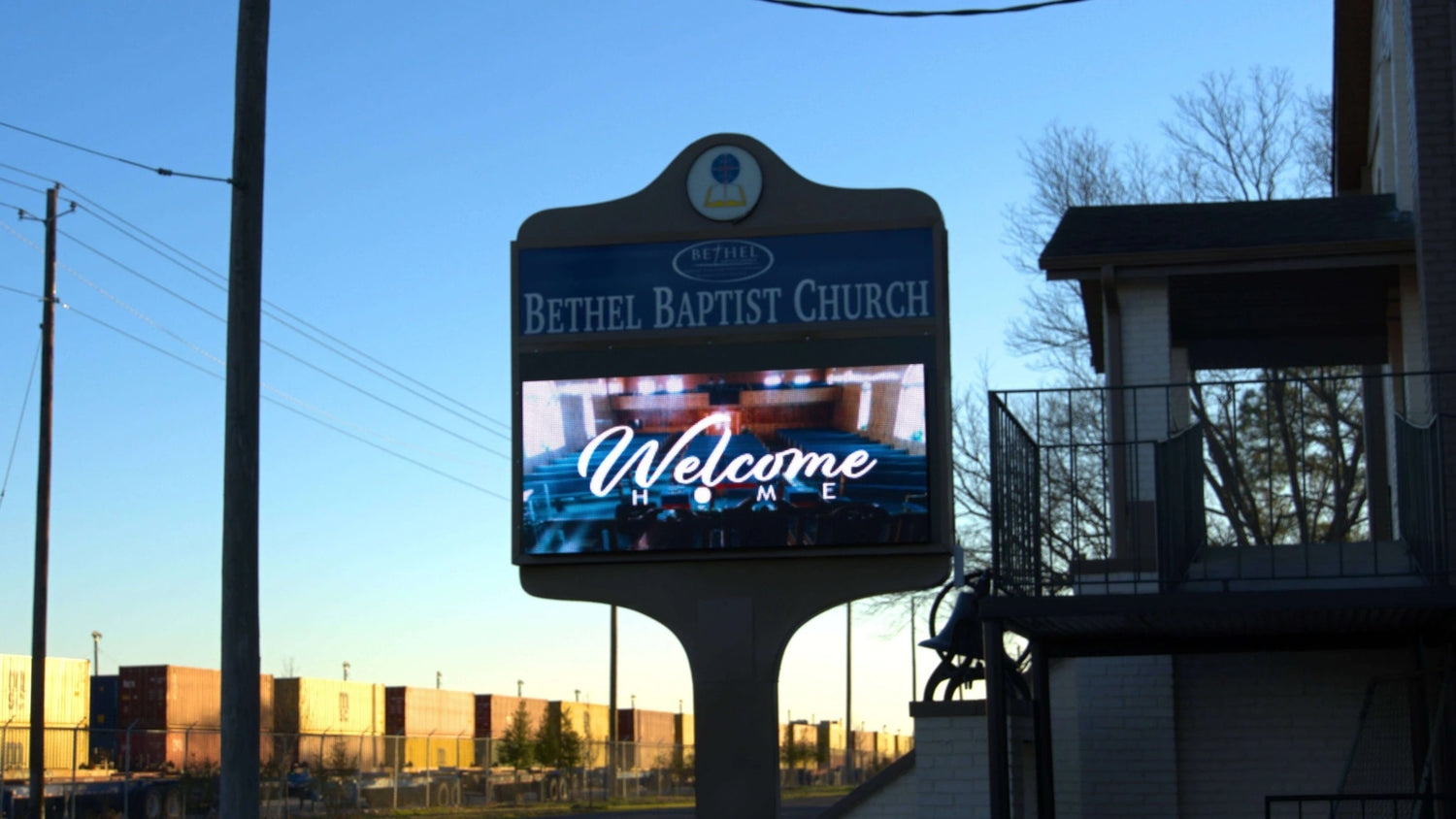 LED sign at Bethel Baptist Church displaying welcome home message inside the sanctuary
